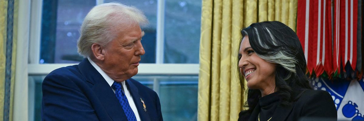Trump and Gabbard shake hands.
