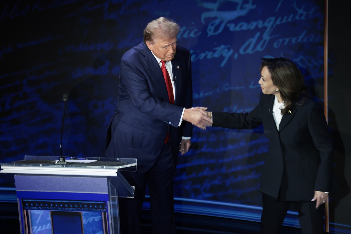 Trump and Harris shake hands before debating.