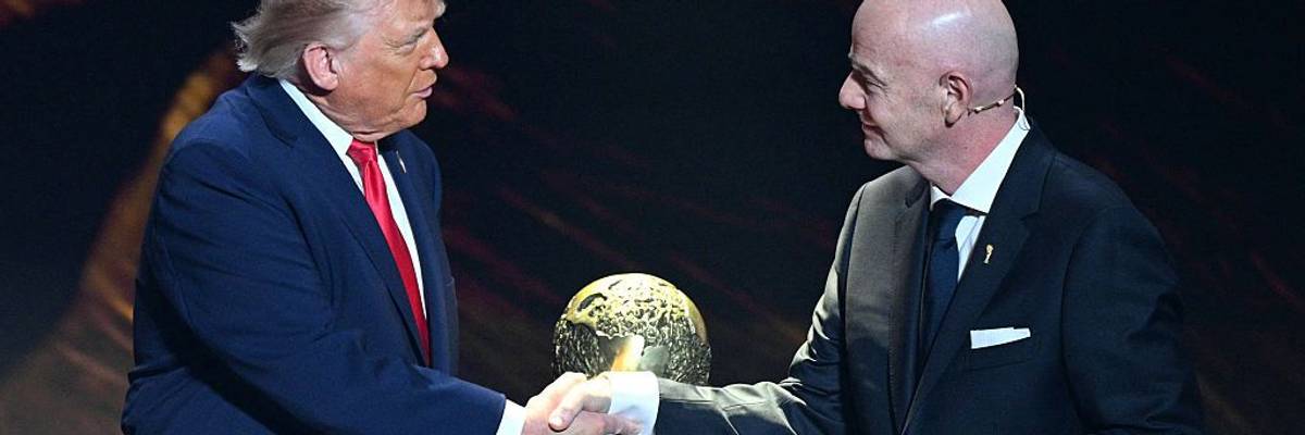 Trump and Infantino of FIFA shake hands in front of FIFA Peace Prize.