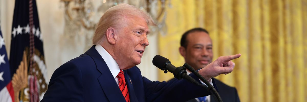 Trump and Tiger Woods at Black History Month celebration in 2025.