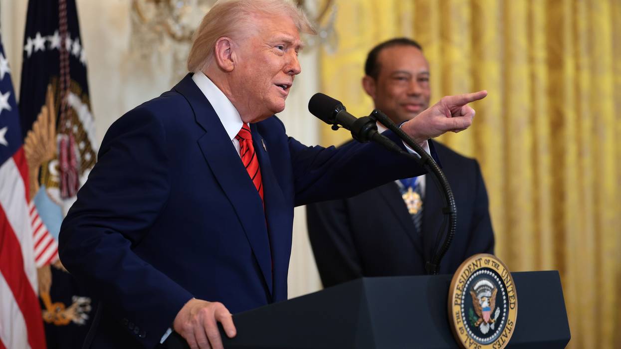 Trump and Tiger Woods at Black History Month celebration in 2025.