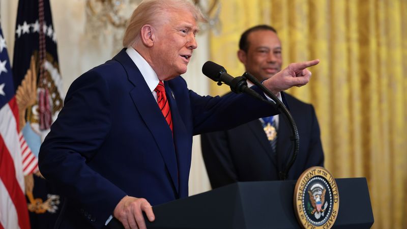 Trump and Tiger Woods at Black History Month celebration in 2025.