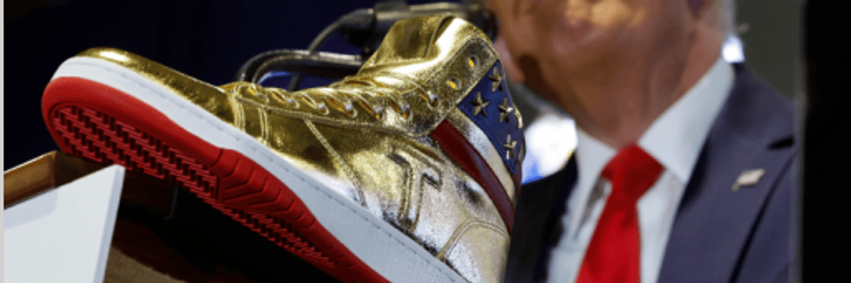 Trump hawks a gold high top at Sneaker Com in Philadelphia a day after he was ordered to pay $354 in a civil fraud suit