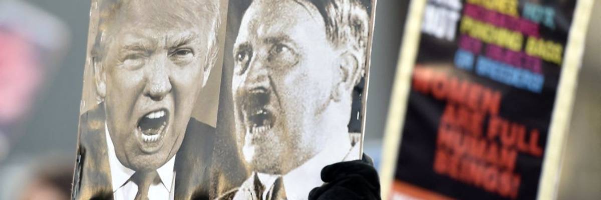Trump Hitler on one sign