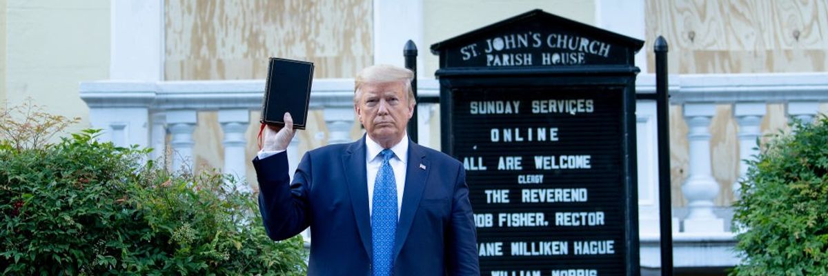 Trump holds a Bible.