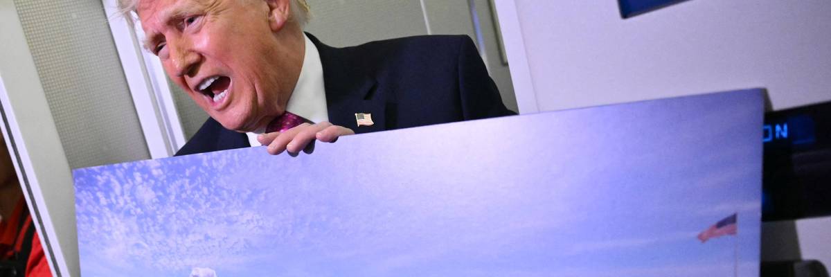 Trump holds a rendering of his East Wing remodel.