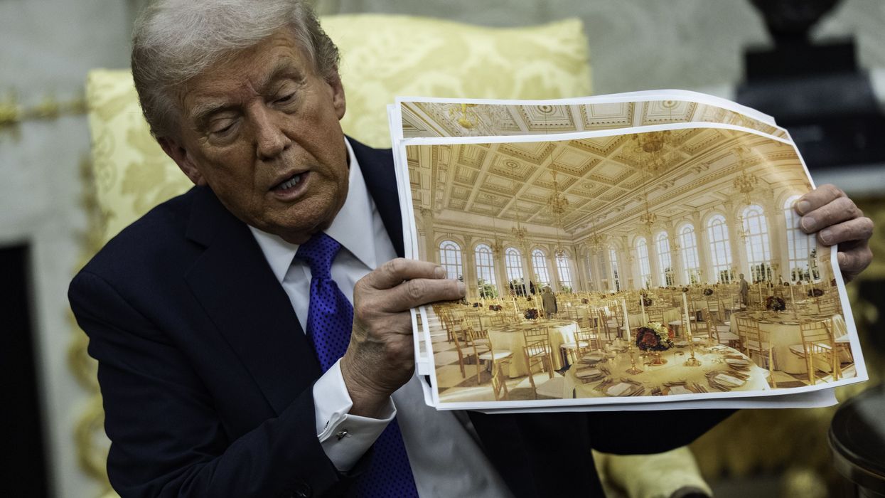 Trump holds photos showing what the White House ballroom will look like