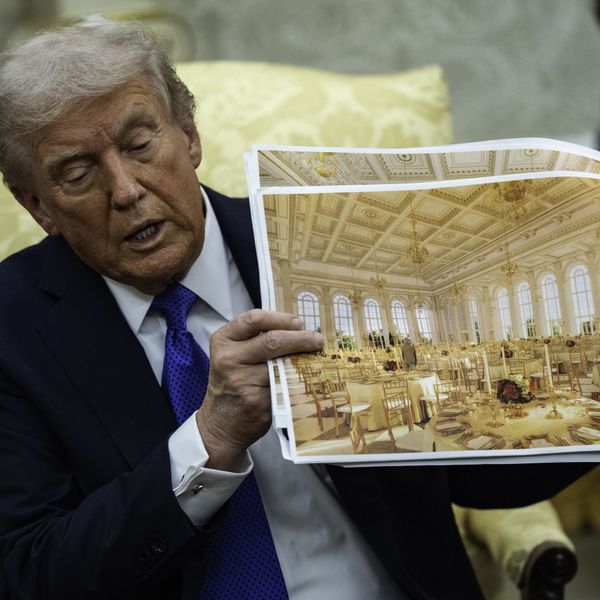 Trump holds photos showing what the White House ballroom will look like