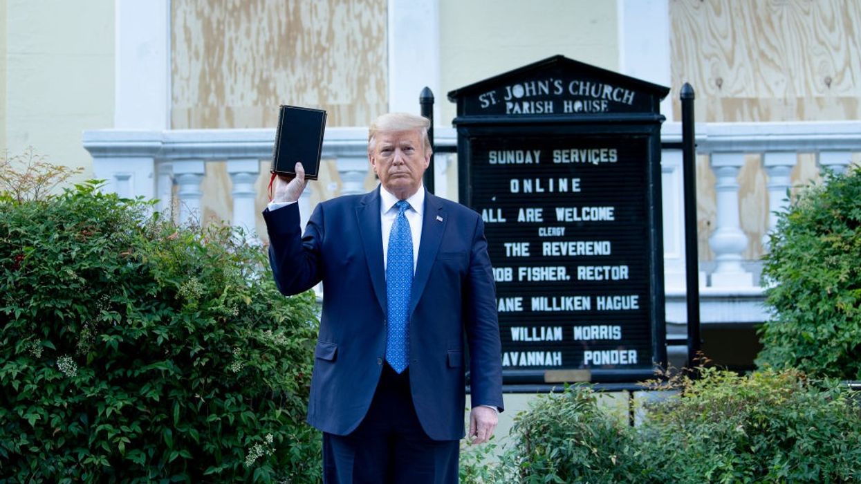 Trump holds up Bible outside church for photo-op