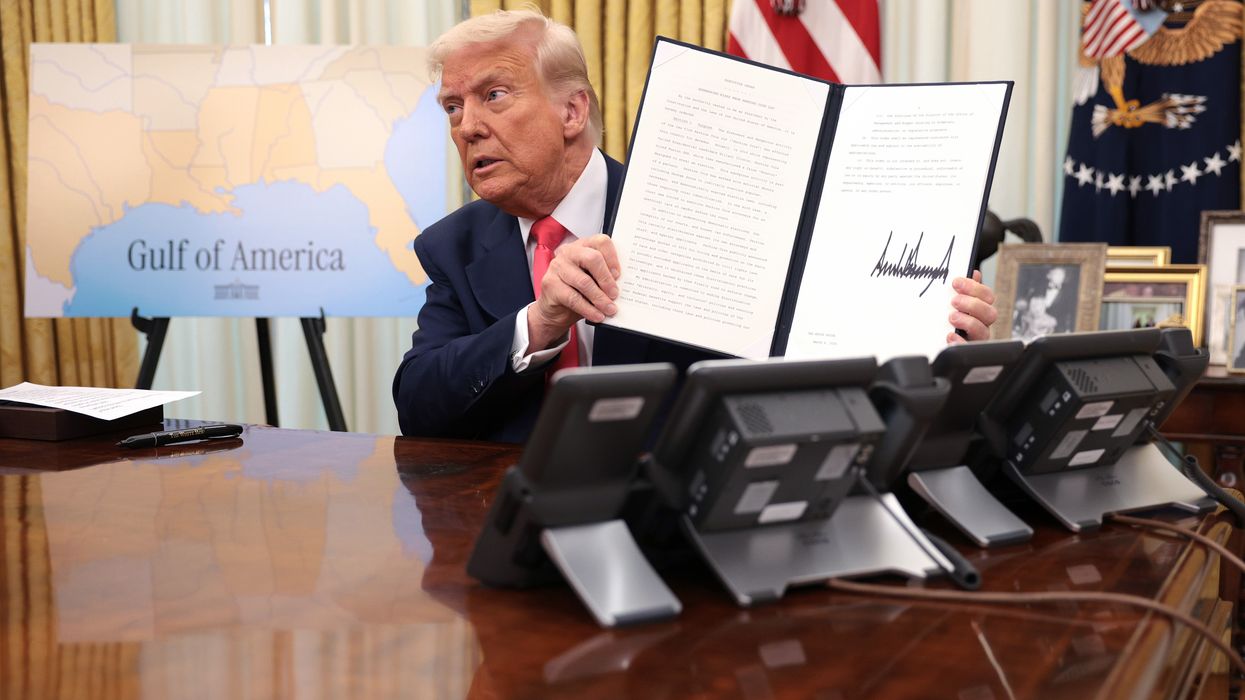 Trump holds up executive order.