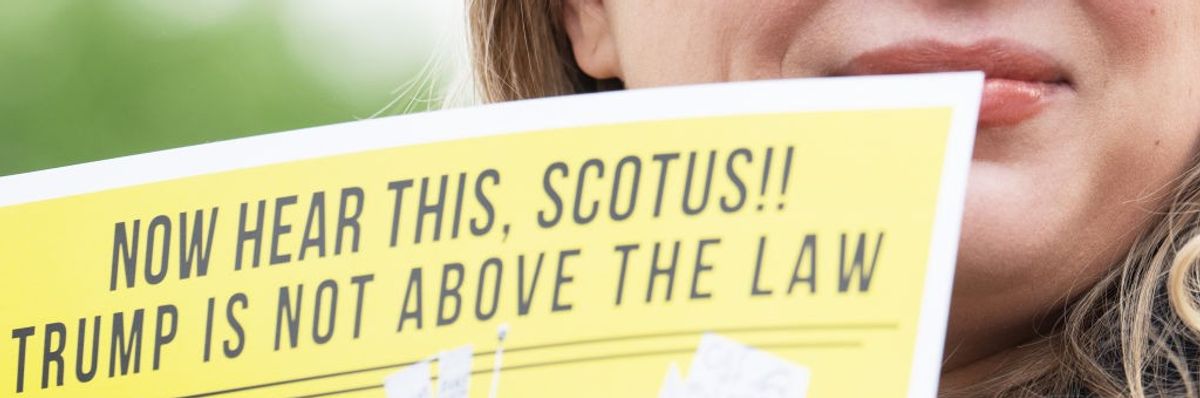 'Trump Is Not Above the Law' sign outside Supreme Court