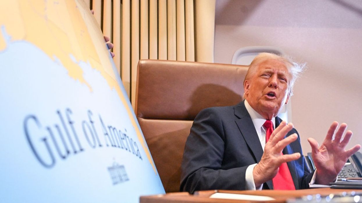 Trump next to 'Gulf of America' sign