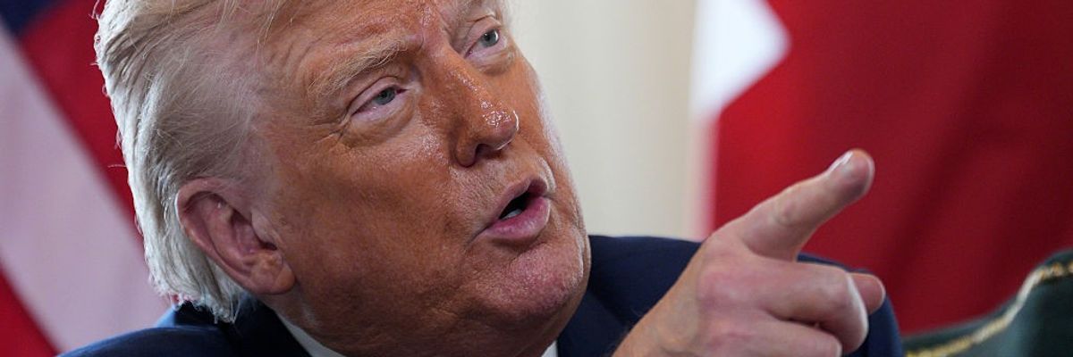 Trump points while speaking.