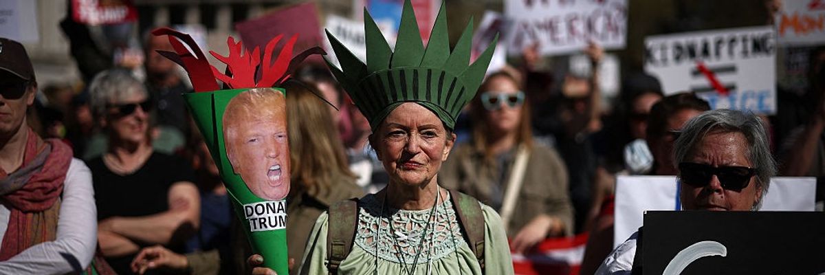Trump protester as Statue of Liberty