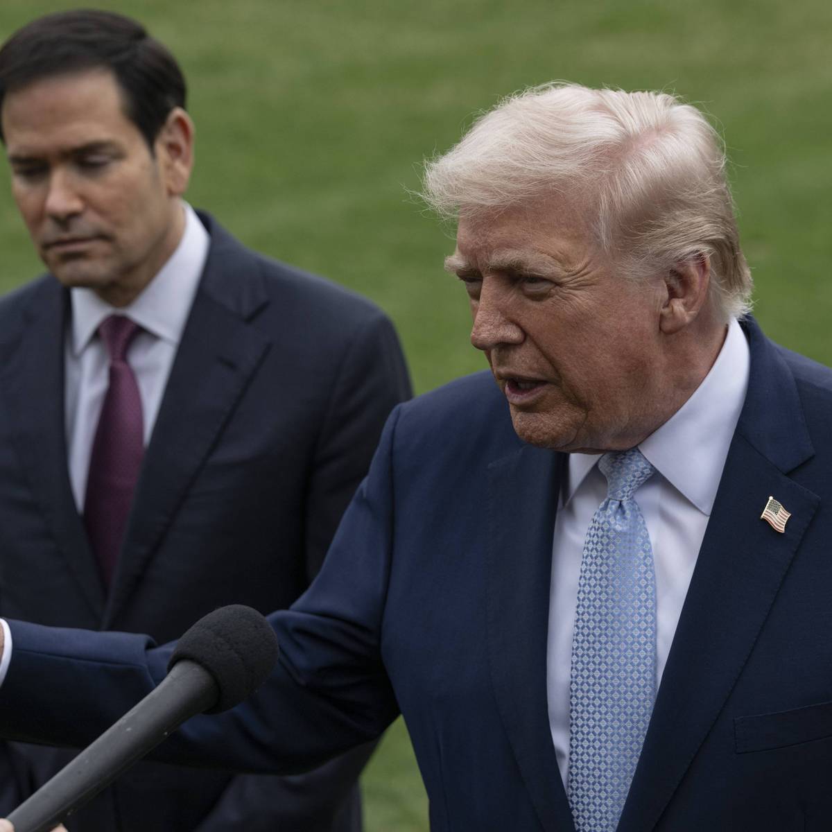 Trump speaks while Marco Rubio looks on