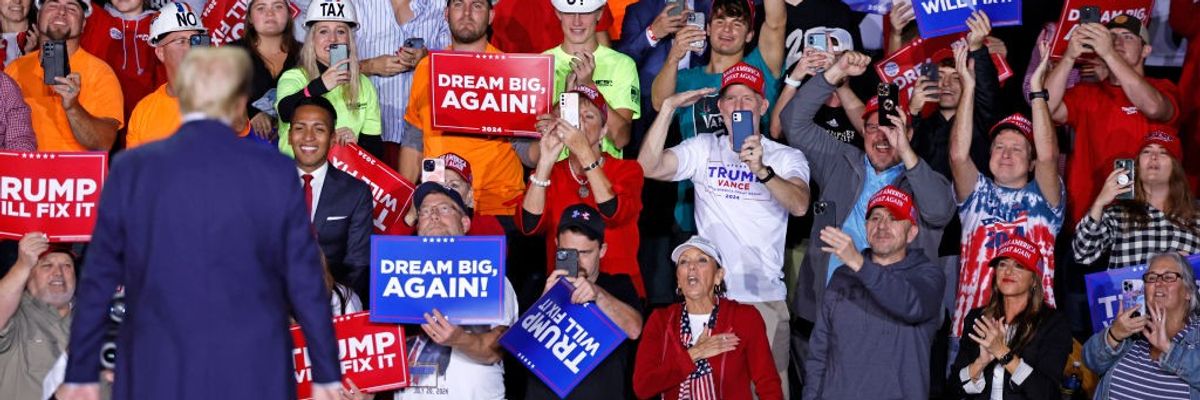 Trump standing before supporters