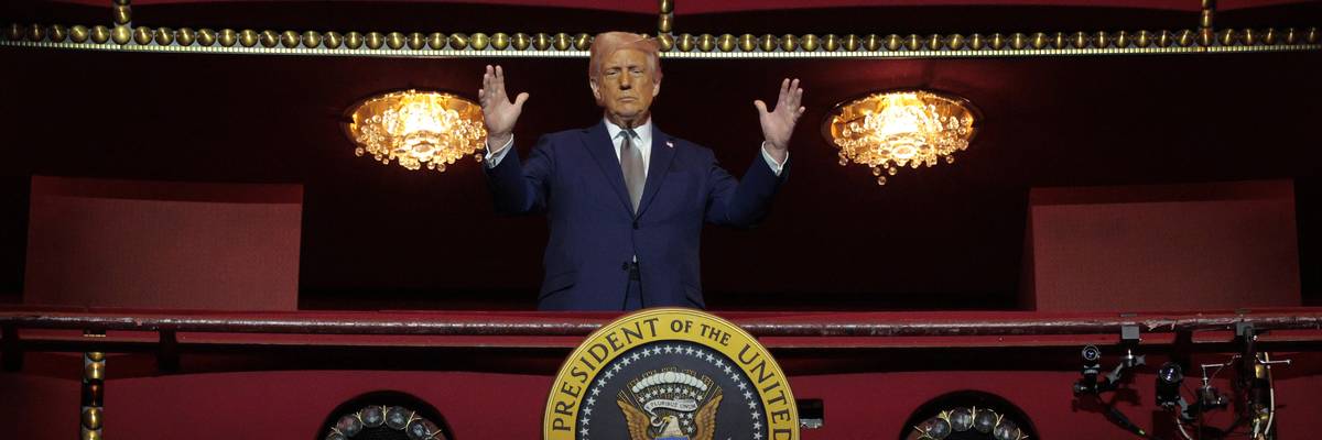 Trump stands in box at Kennedy Center.