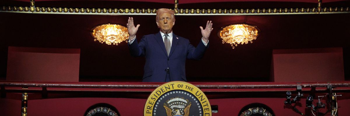 Trump stands in box at Kennedy Center.