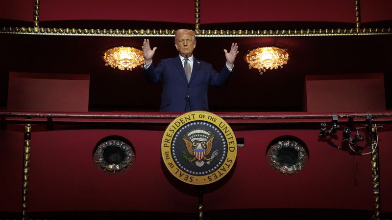 Trump stands in box at Kennedy Center.