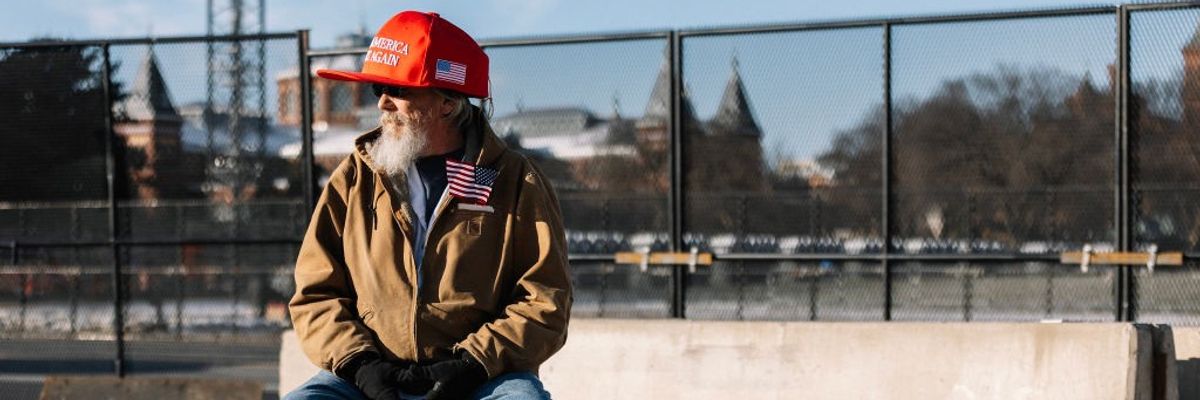 Trump support wearing oversized MAGA hat