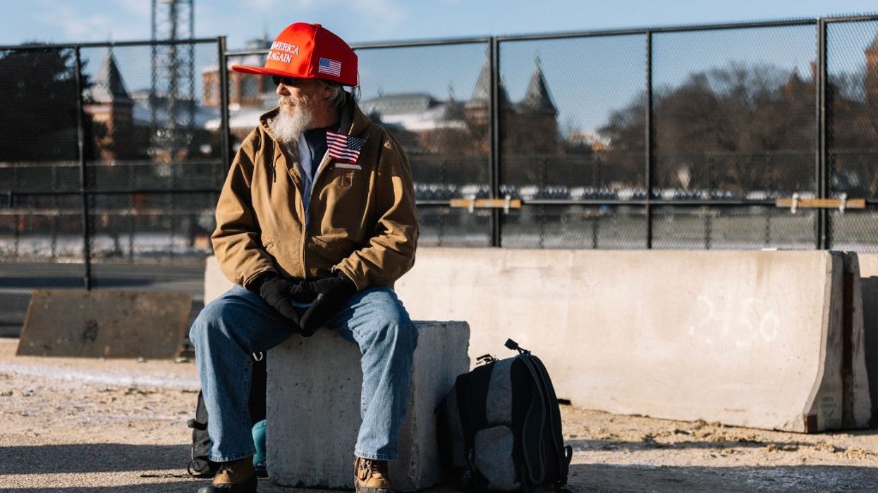 Trump support wearing oversized MAGA hat