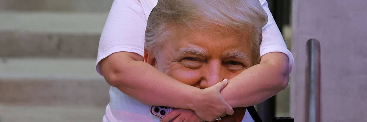 Trump supporter holds picture of his face