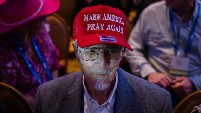 Trump supporter wearing a "MAKE AMERICA PRAY AGAIN" 