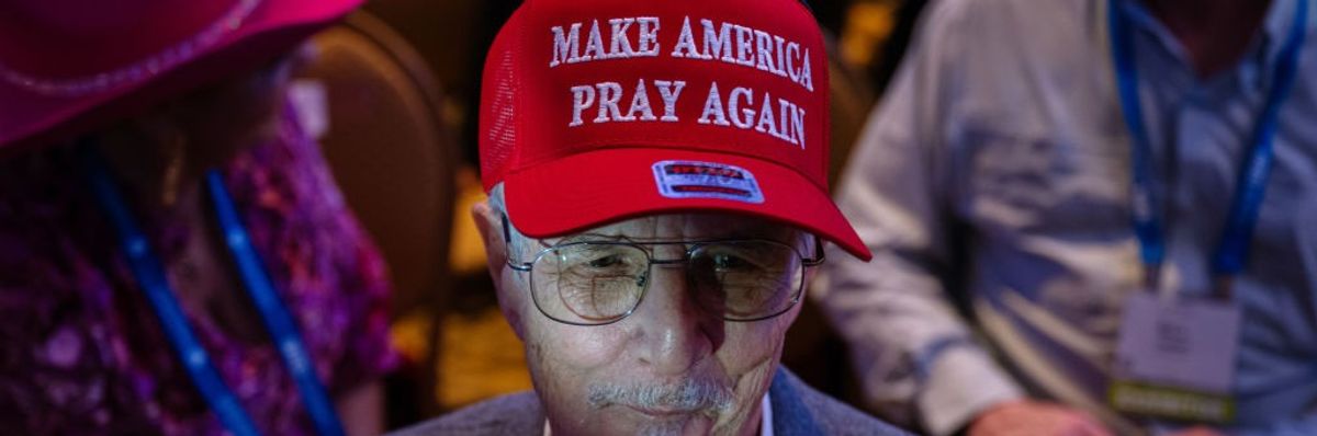 Trump supporter wearing a "MAKE AMERICA PRAY AGAIN" 