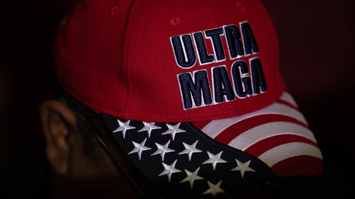 Trump supporter with a hat that reads "Ultra MAGA"