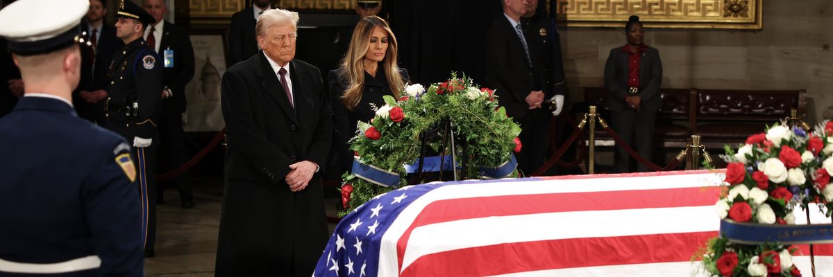 Trump views Carter's coffin.