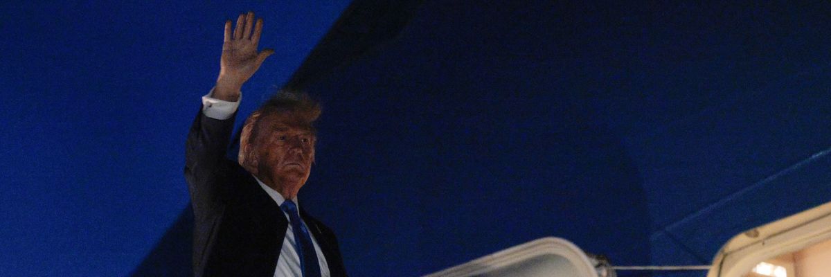Trump waves from Air Force One.