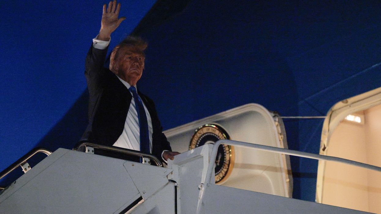 Trump waves from Air Force One.