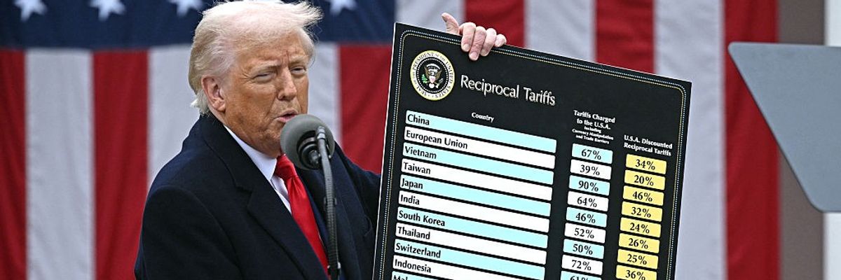 Trump with chart of reciprocal tariffs.