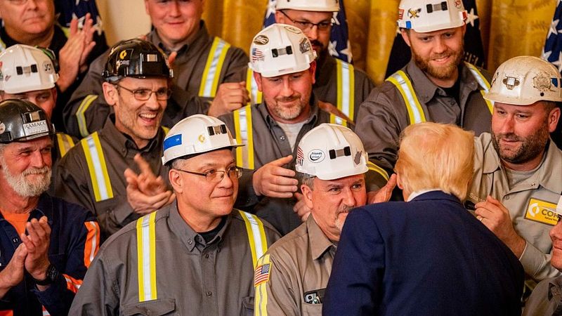 Trump with coal miners at the White House