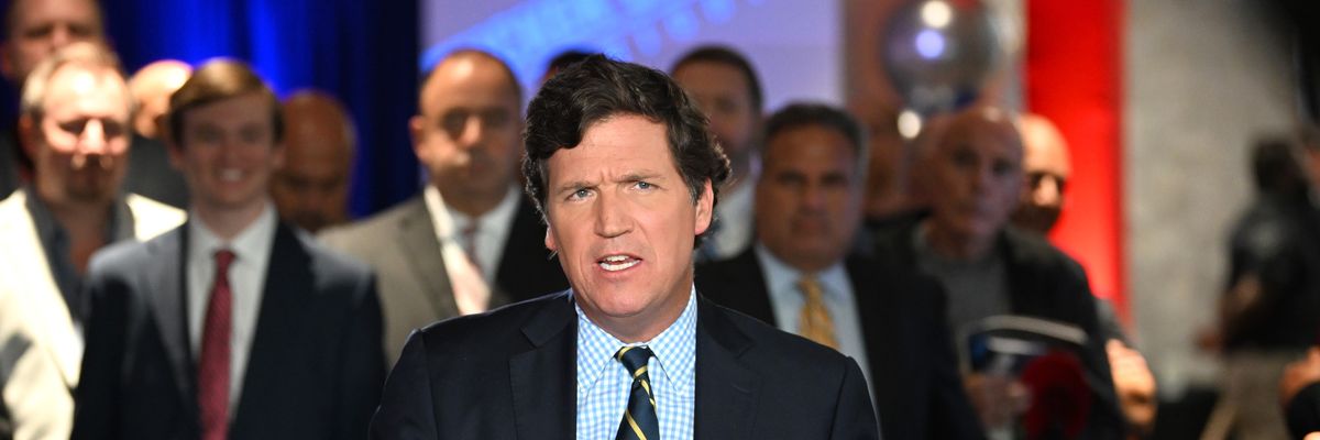 Tucker Carlson speaks during an event