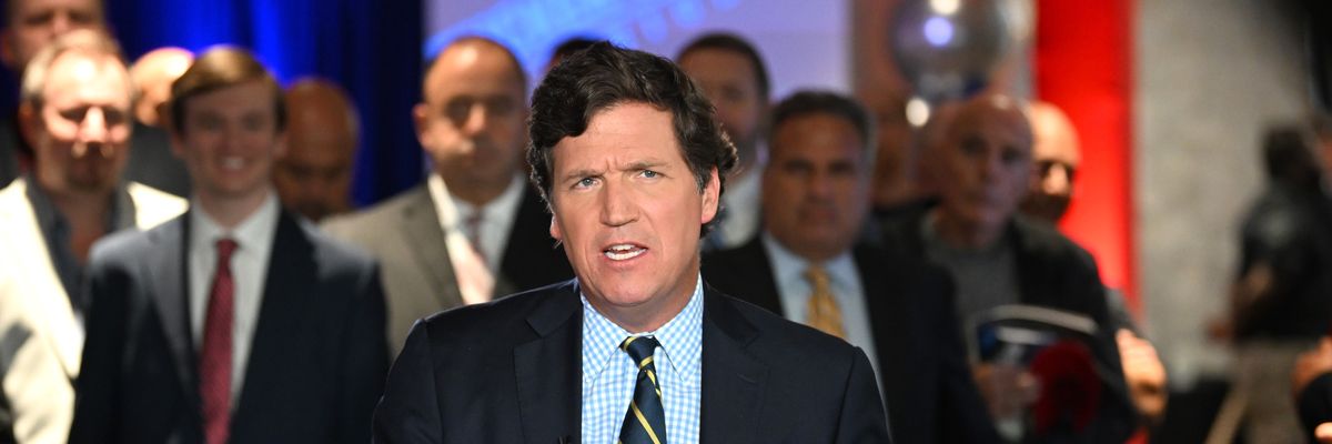 Tucker Carlson speaks during an event