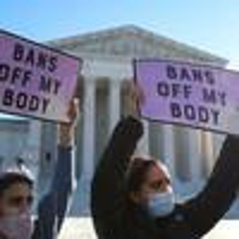Two demonstrators at a pro-choice demonstration at the Supreme Court