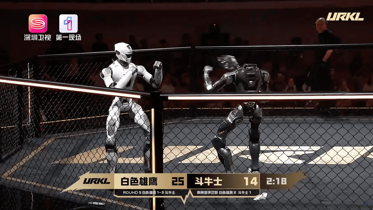 Two humanoid robots fight at the Ultimate Robot Knock-out Legend