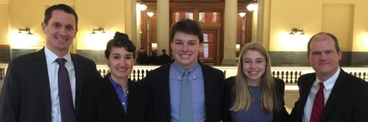 Two of the Massachusetts youth plaintiffs, Shamus Miller and Olivia Gieger, accompanied by their lawyers, Phelps Turner, Jennifer Rushlow, and Dylan Sanders, after a hearing in January.