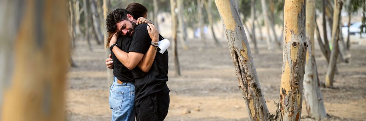 two people embrace at site of Oct 7 attack on Nova Festival in southern Israel