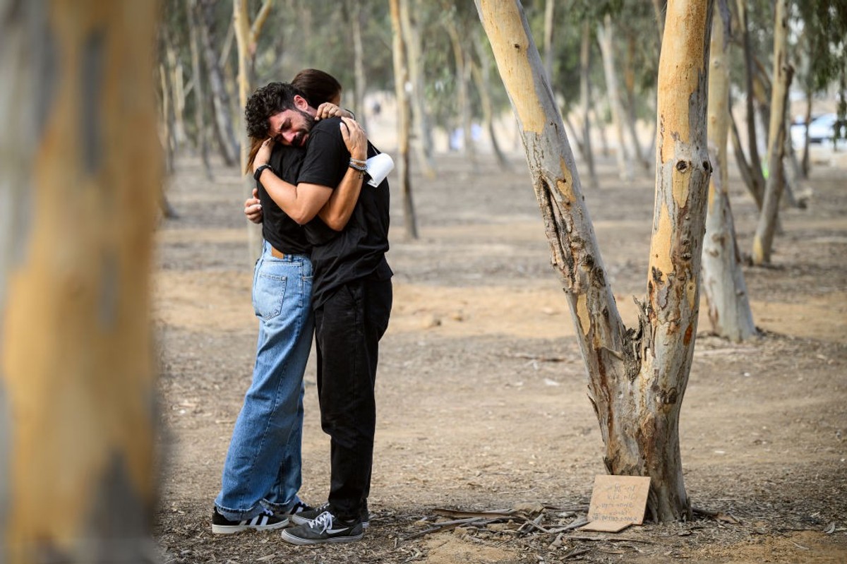 two people embrace at site of Oct 7 attack on Nova Festival in southern Israel