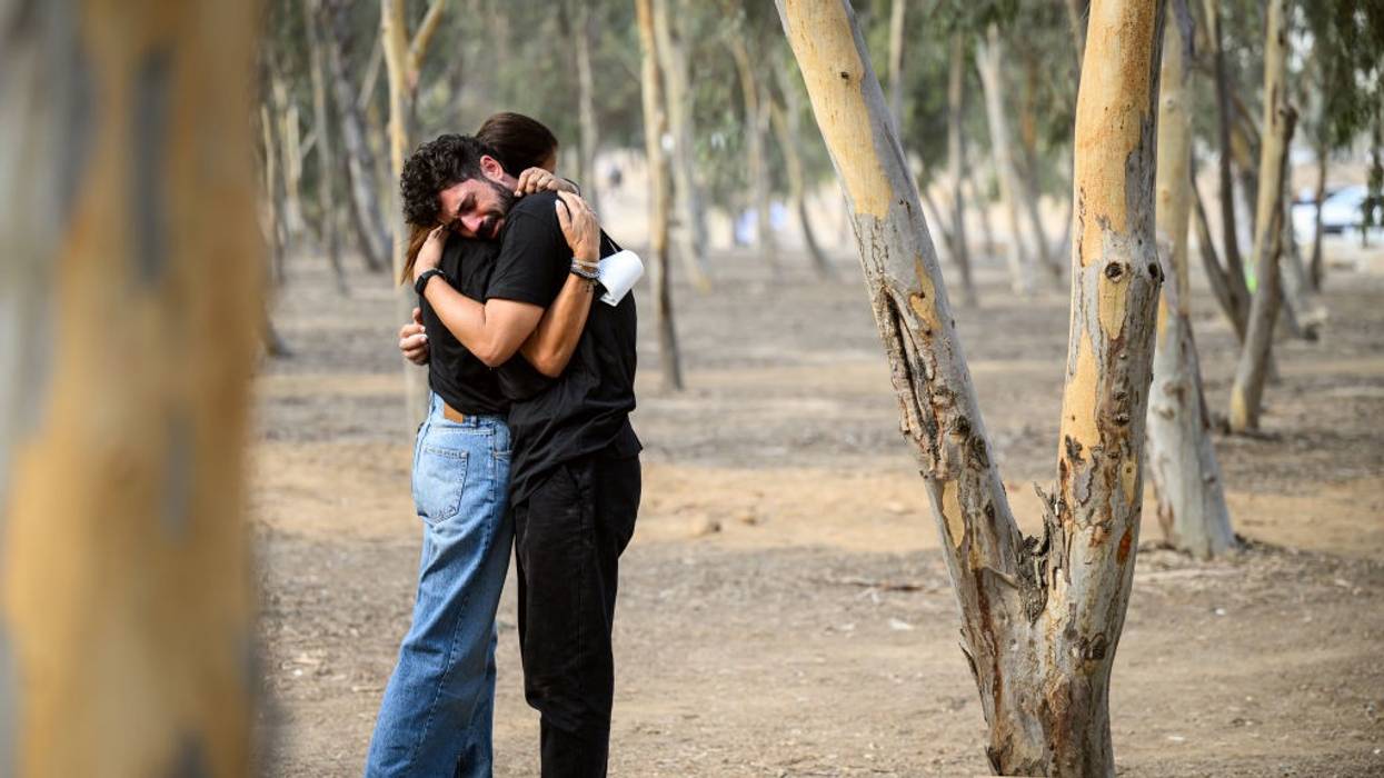 two people embrace at site of Oct 7 attack on Nova Festival in southern Israel