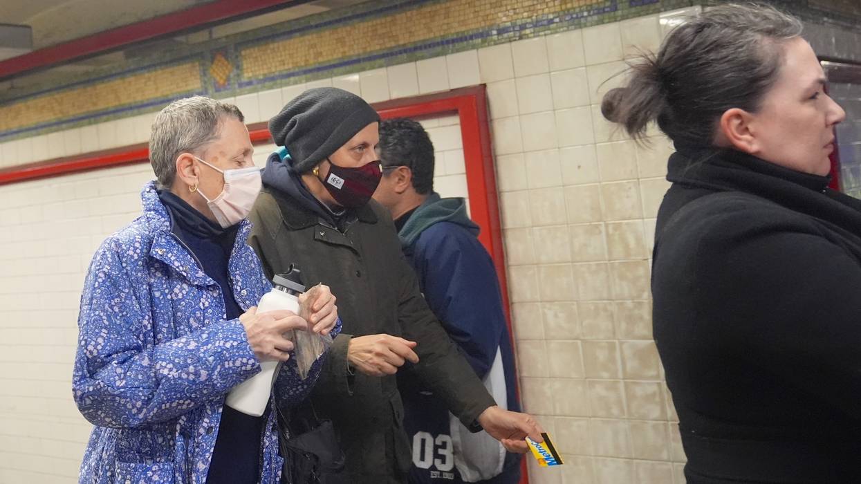Two people wear face masks in New York City