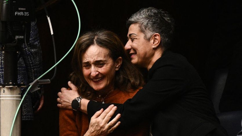 Two women embrace in Greece's Parliament after it voted to legalize same-sex marriage