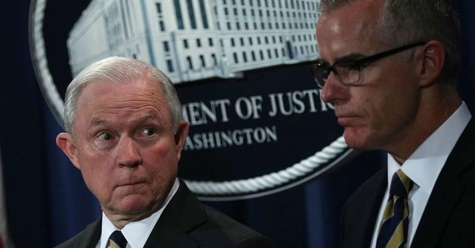 U.S. Attorney General Jeff Sessions (L) and Acting FBI Director Andrew McCabe (R) during a news conference to announce significant law enforcement actions July 13, 2017 at the Justice Department in Washington, DC. Late Friday night, Sessions announced that McCabe, who announced his retirement weeks ago and was scheduled to end his career at the FBI on Sunday, was being terminated effective immediately. (Photo: Alex Wong/Getty Images)