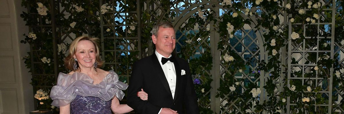 U.S. Chief Justice John Roberts and his wife, Jane Sullivan Roberts, arrive in the Booksellers Area of the White House