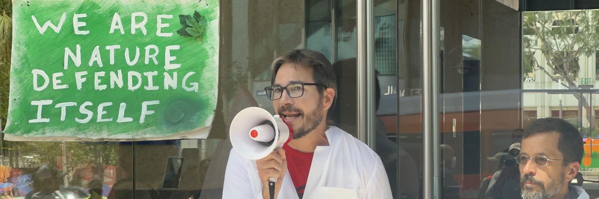 U.S. climate scientist Peter Kalmus is seen outside a JPMorgan Chase building in Los Angeles on April 6, 2022. Along with several others, he locked himself to the front door of the building and was ultimately arrested as they engaged in civil disobedience as part Scientist Rebellion's week of action. (Photo: Scientist Rebellion)
