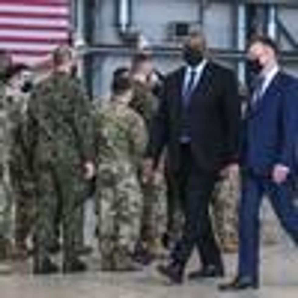 U.S. Defense Secretary Lloyd Austin speaks with his Polish counterpart