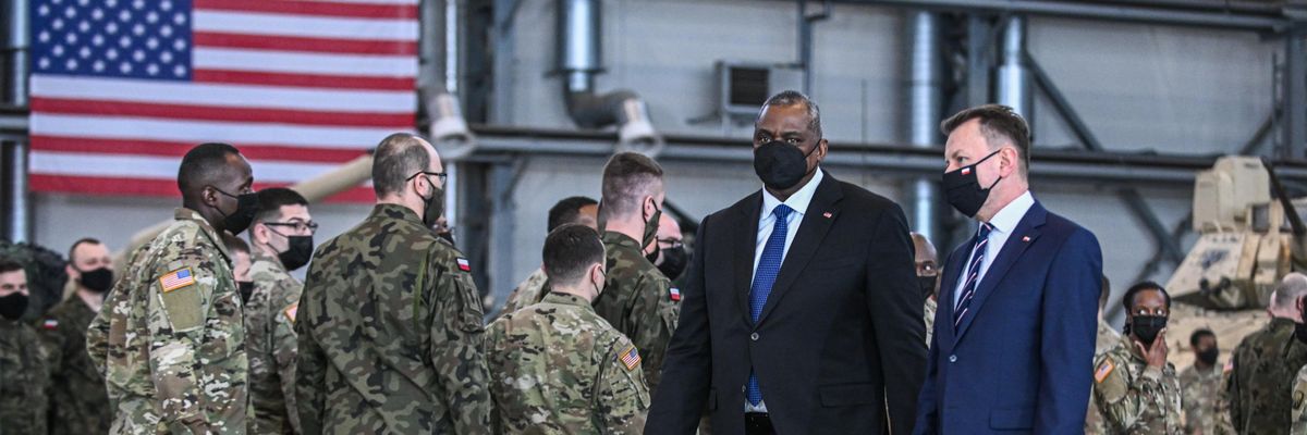 U.S. Defense Secretary Lloyd Austin speaks with his Polish counterpart
