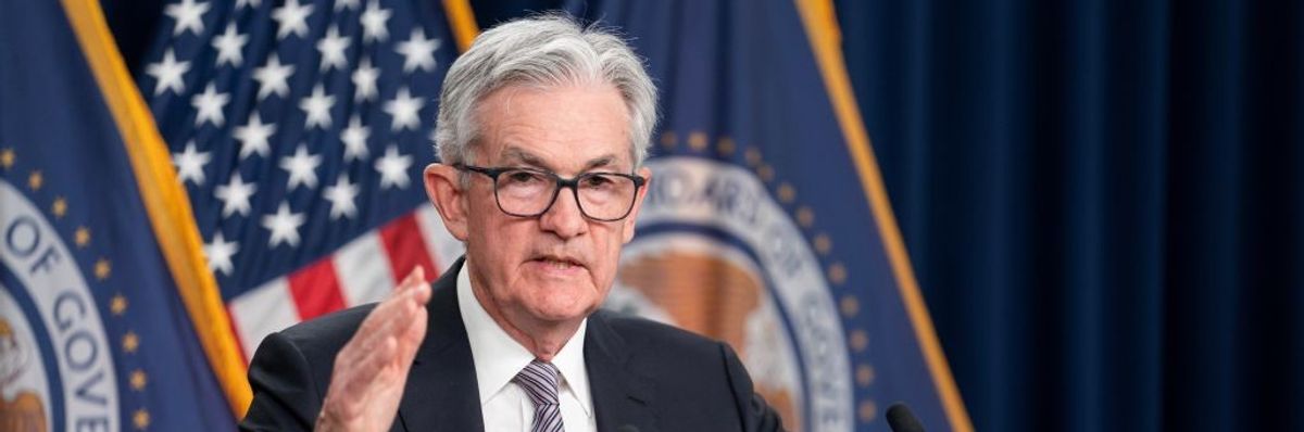 U.S. Federal Reserve Chair Jerome Powell stands at a podium. 